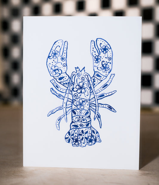 Card with a blue lobster design on a white background