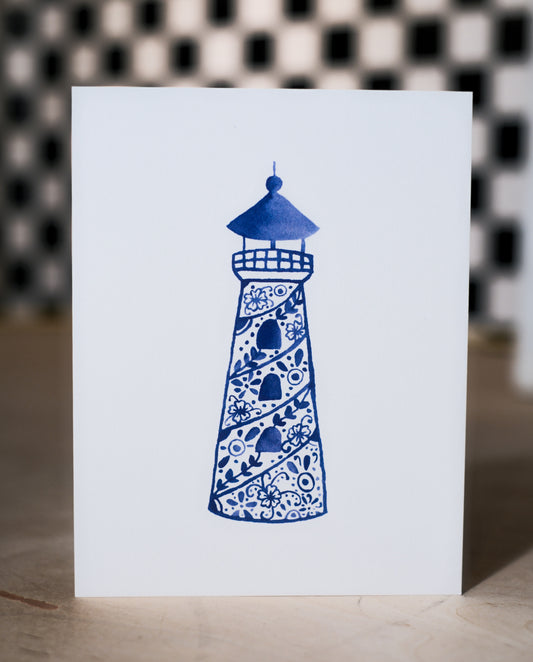 Card with a blue lighthouse design on a white background