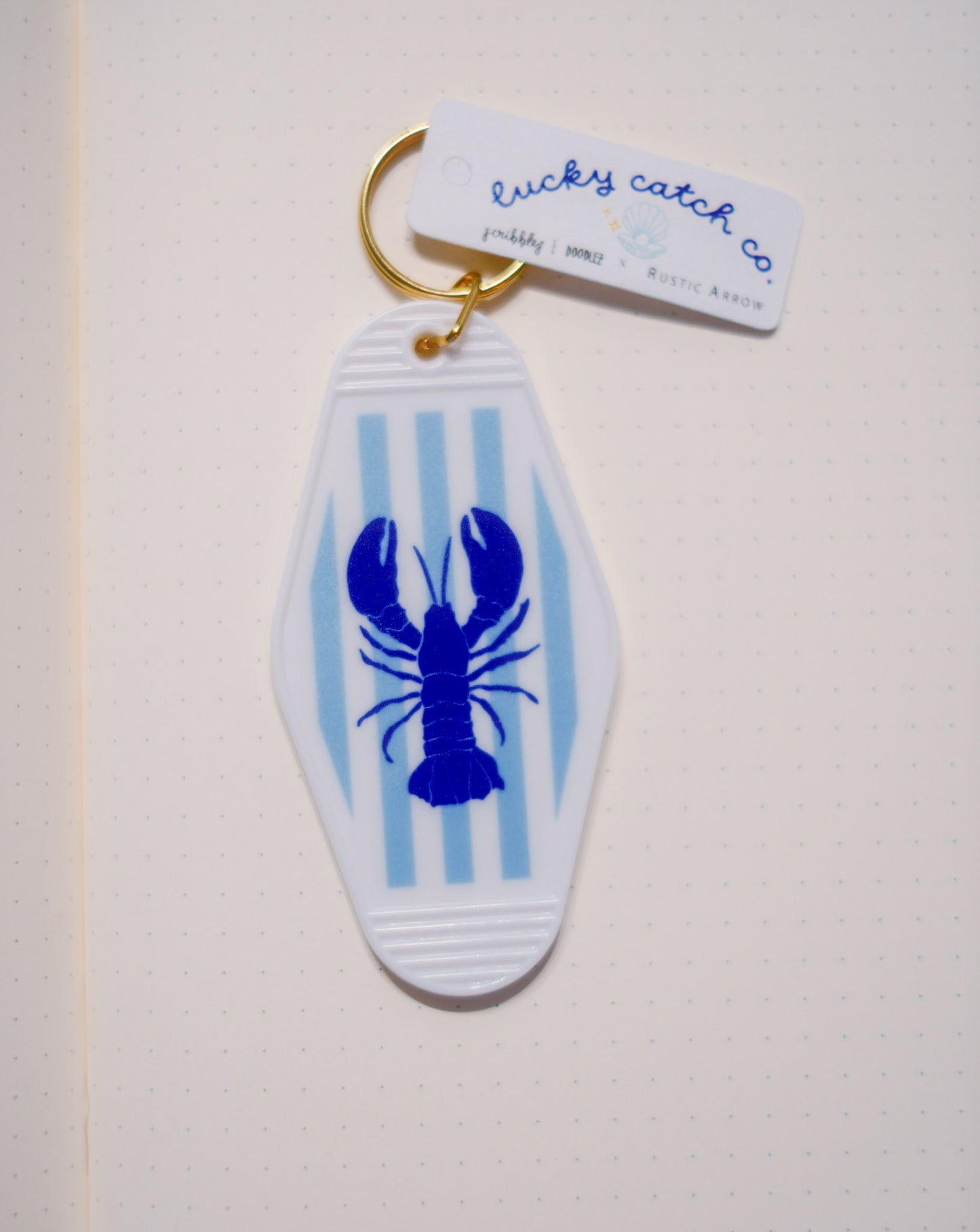 striped royal blue lobster acrylic motel keychain