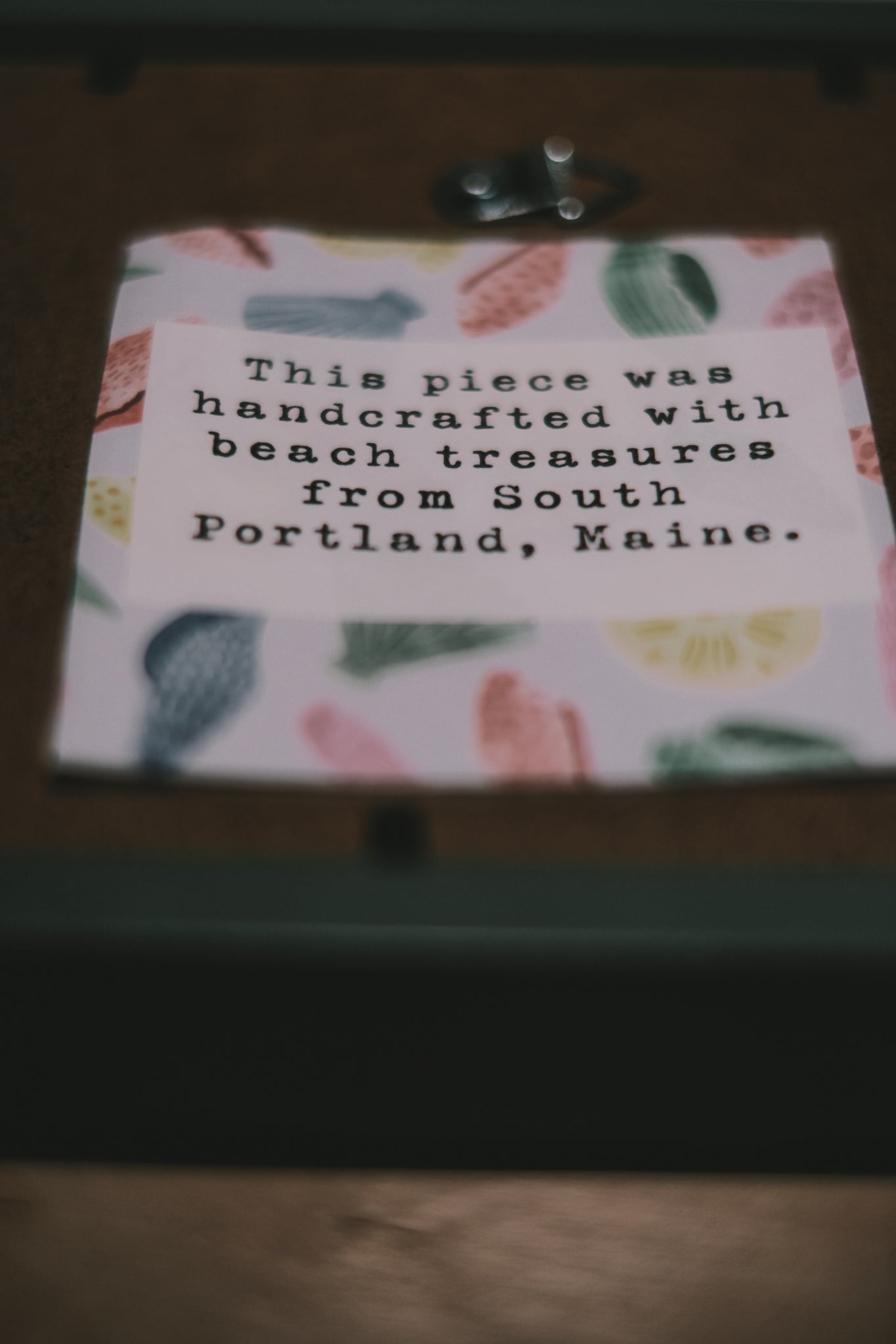Card with shell design and text about beach treasures from South Portland, Maine.