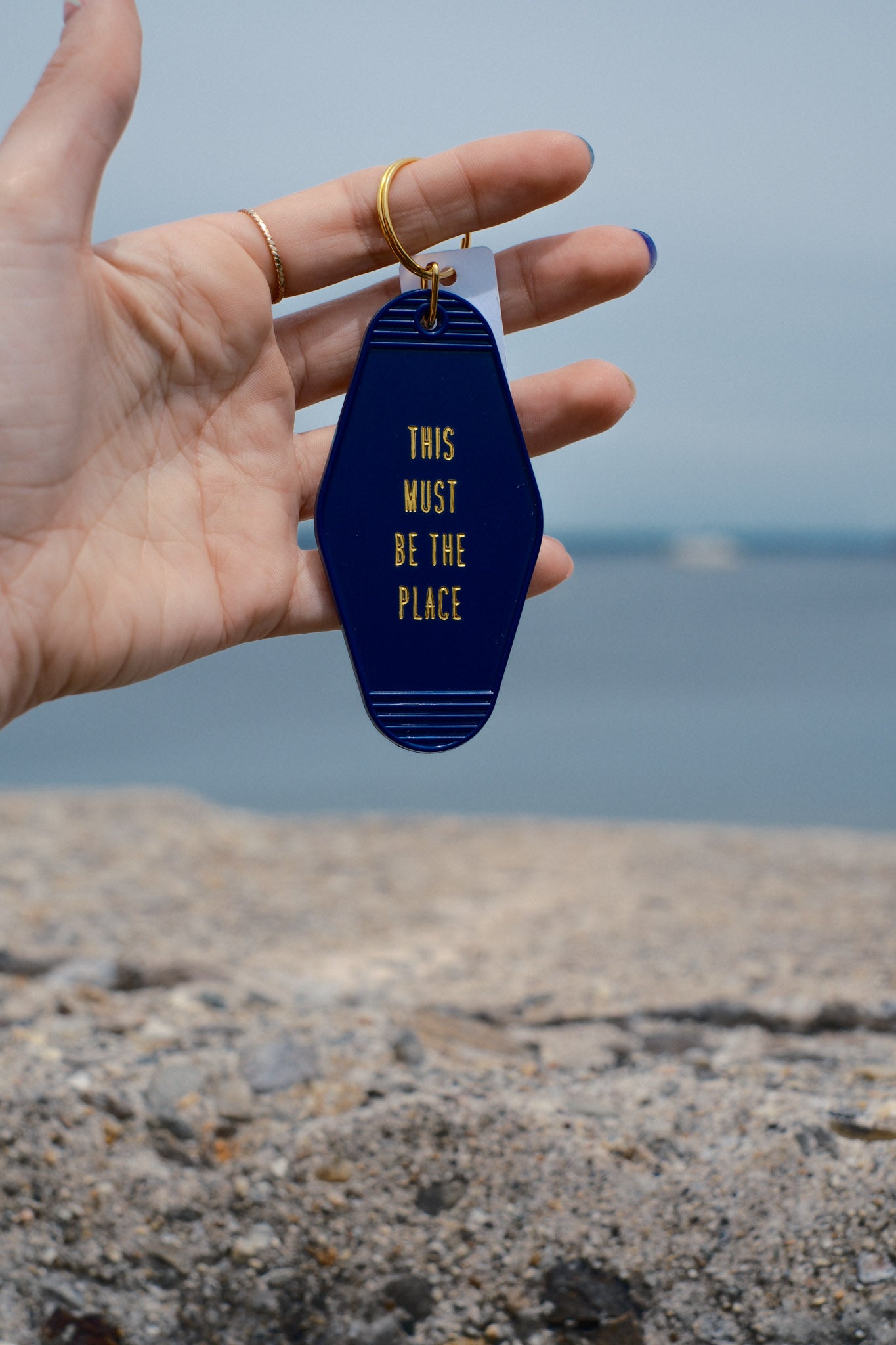 embossed gold maine navy acrylic motel keychain