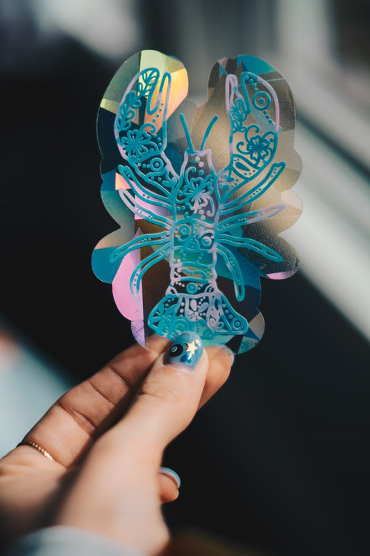 pink and blue lobster sun catcher decal with flower pattern.