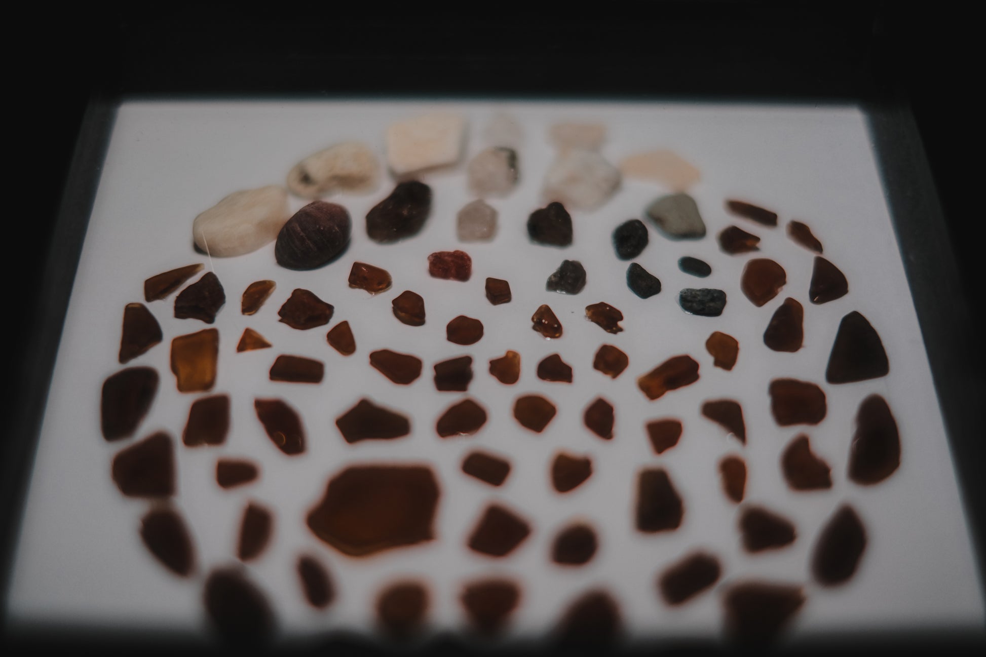 Mosaic pattern made of small stones on a white background