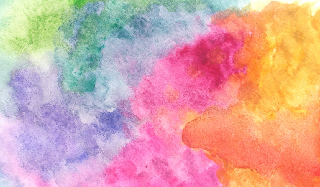 A vibrant watercolor painting with blended colors including green, blue, purple, pink, red, orange, and yellow, creating a soft, abstract, and cloud-like texture.